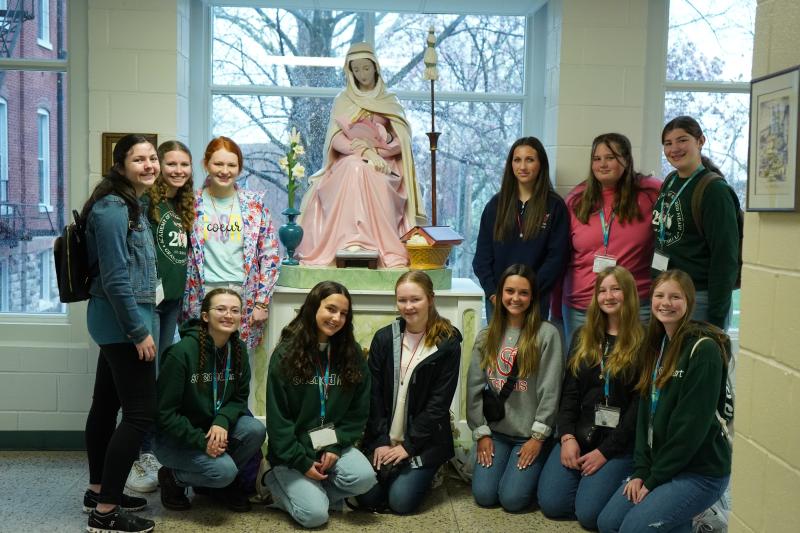 Students pose with the statue of Mater located at the Academy of the Sacred Heart in St. Charles Students pose with the statue of Mater located at the Academy of the Sacred Heart in St. Charles